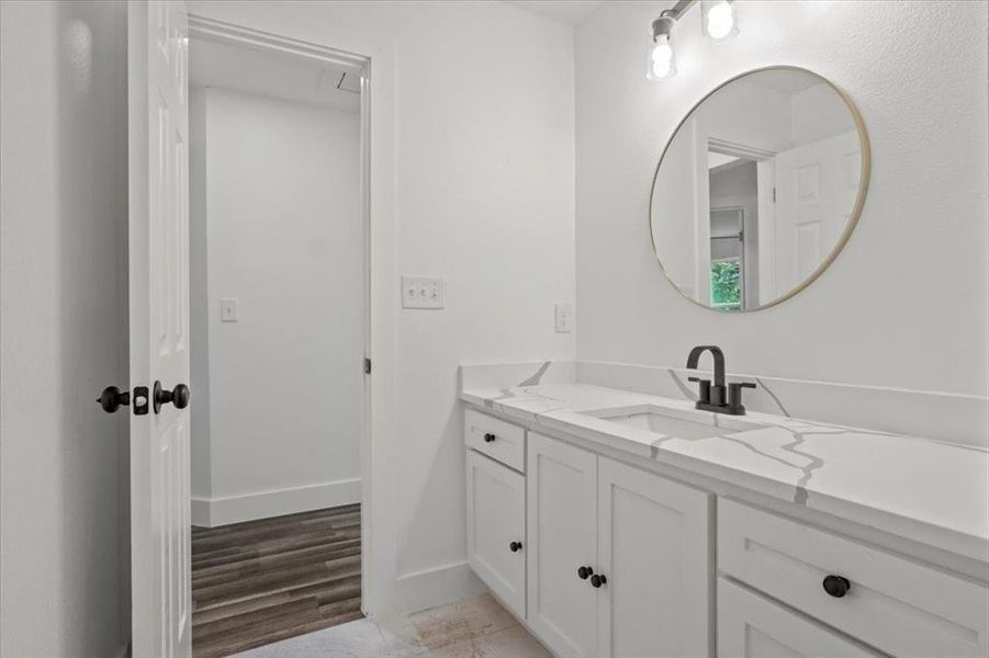 Bathroom with wood-type flooring and vanity