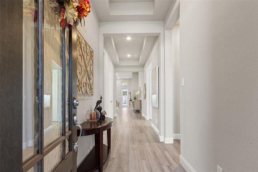 Step into sophistication with this stunning foyer that offers direct access to a handy garage. As you explore further, two charming secondary bedrooms awaits, complete with full bathrooms, ensuring comfort and convenience in your new home.