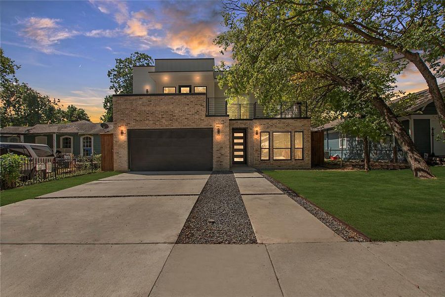 Contemporary house with a yard and a garage