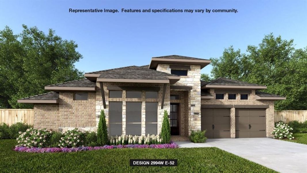 Prairie-style house featuring a garage and a front yard