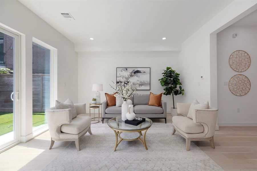 This spacious living area leaves little to be desired.  11 foot ceilings, white oak floors and floor to ceiling sliding doors are just a few of the designer level features.