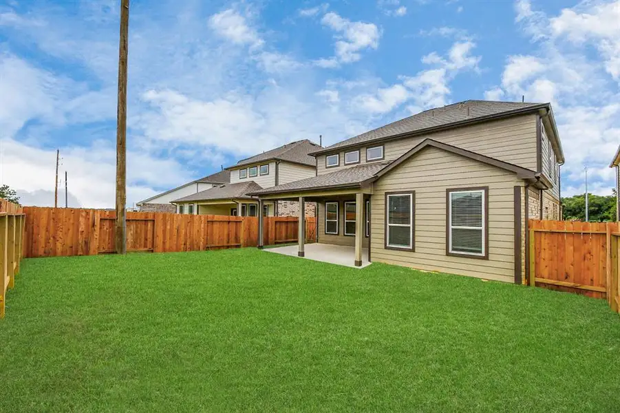 Backyard retreat, offering an abundance of space for kids to play and explore. The possibilities are endless in this outdoor haven, where the joy of open-air activities and family gatherings awaits.