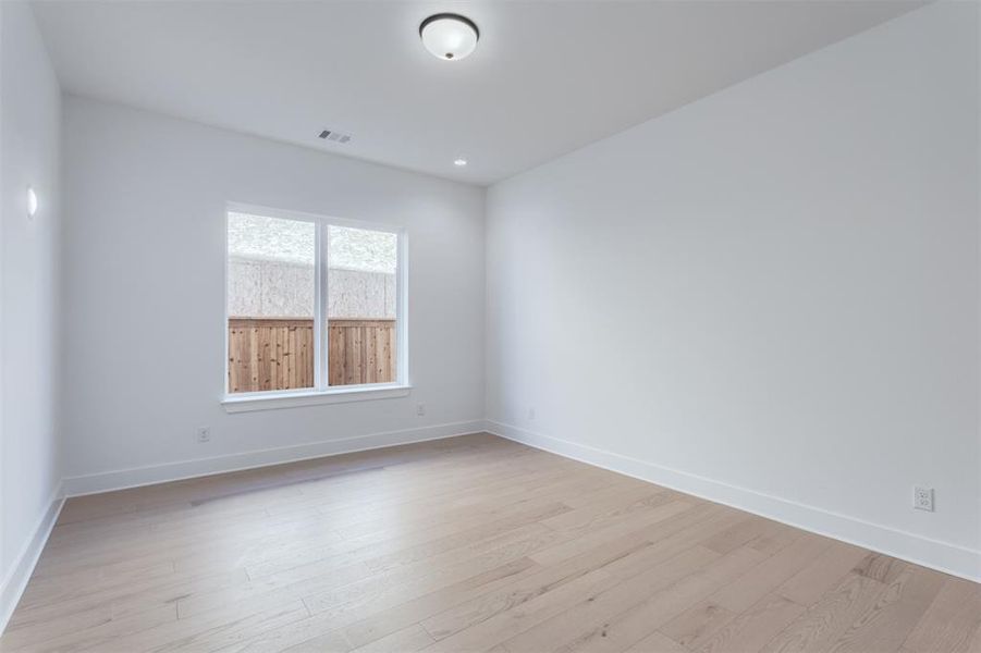 Empty room featuring light hardwood / wood-style flooring