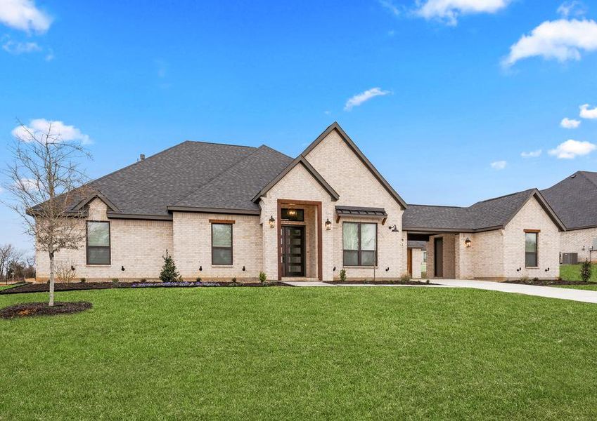 The Garza is a beautiful, one-story brick home with wood accents.