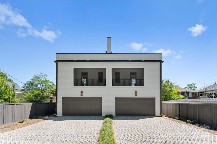 Rear driveway, garage and screened porch: Unit A is on the right