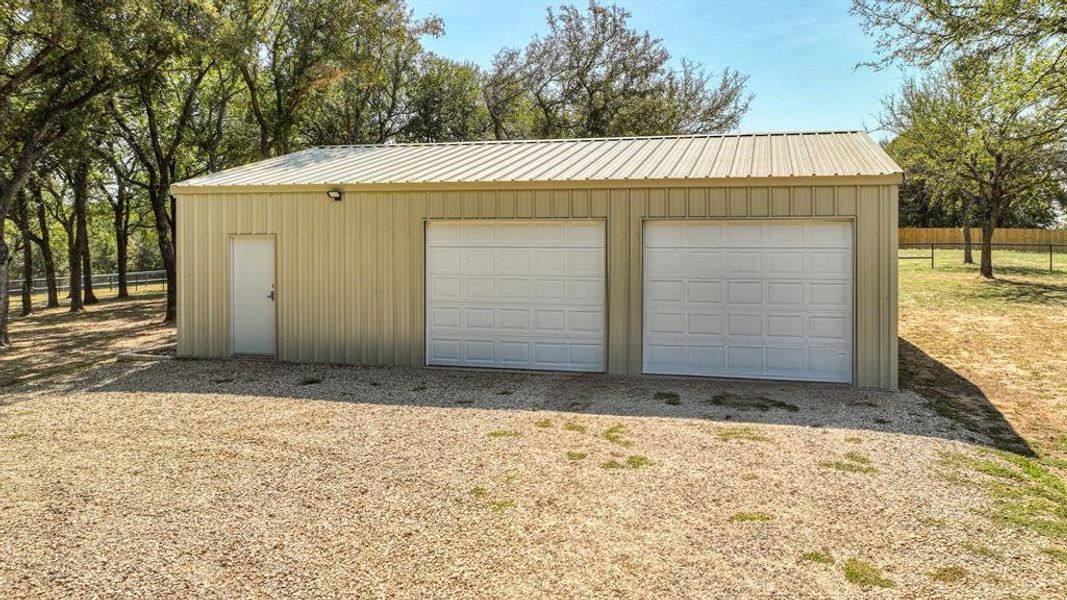 Garage featuring wood walls