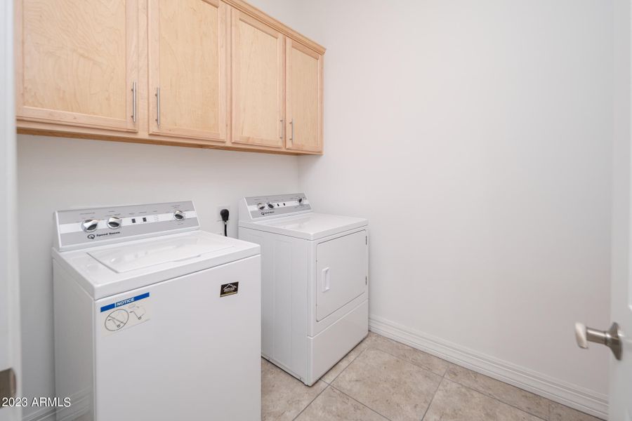 Laundry room cabinets above washer/dryer