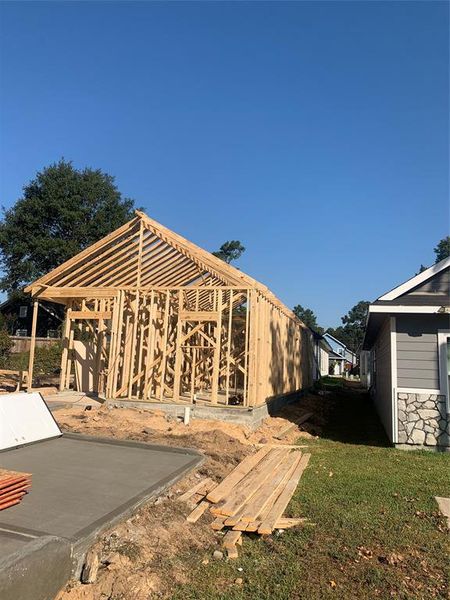 Actual house being framed and driveway poured.