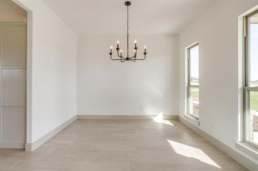 Empty room with a notable chandelier