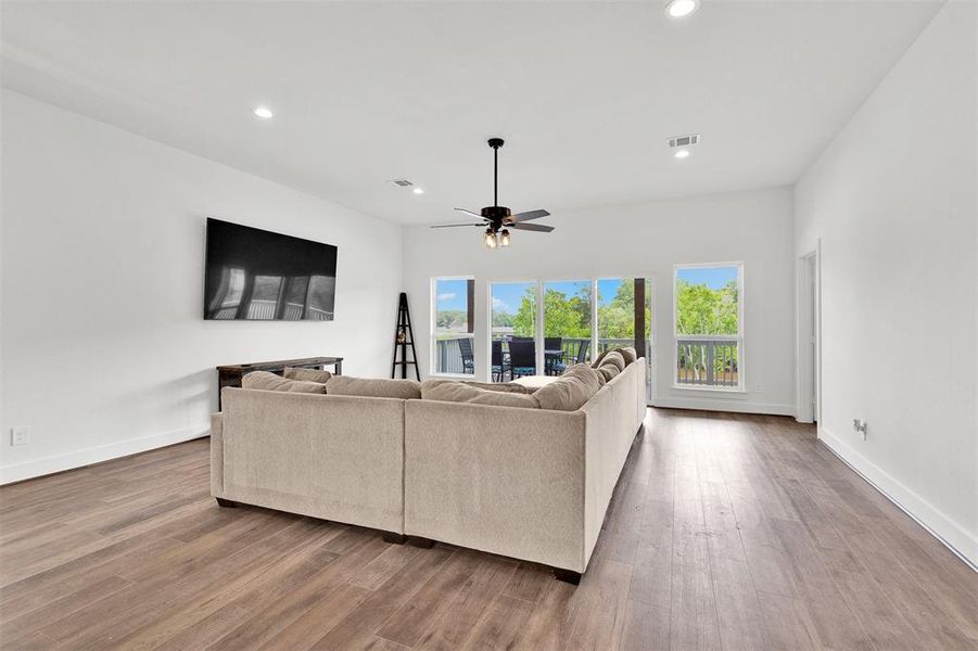 Spacious living room with access to a balcony overlooking the bayou.