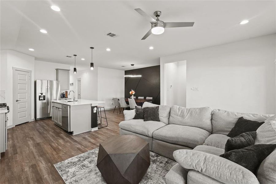 The family room blends seamlessly into the kitchen and beyond providing carefree flow between the living spaces