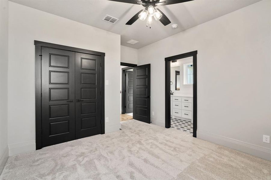 A view of the bathroom and double reach-in closet.