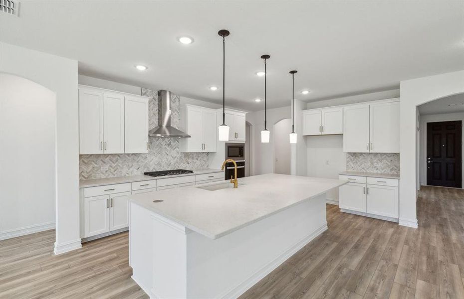 Spacious kitchen with oversized kitchen *real home pictured