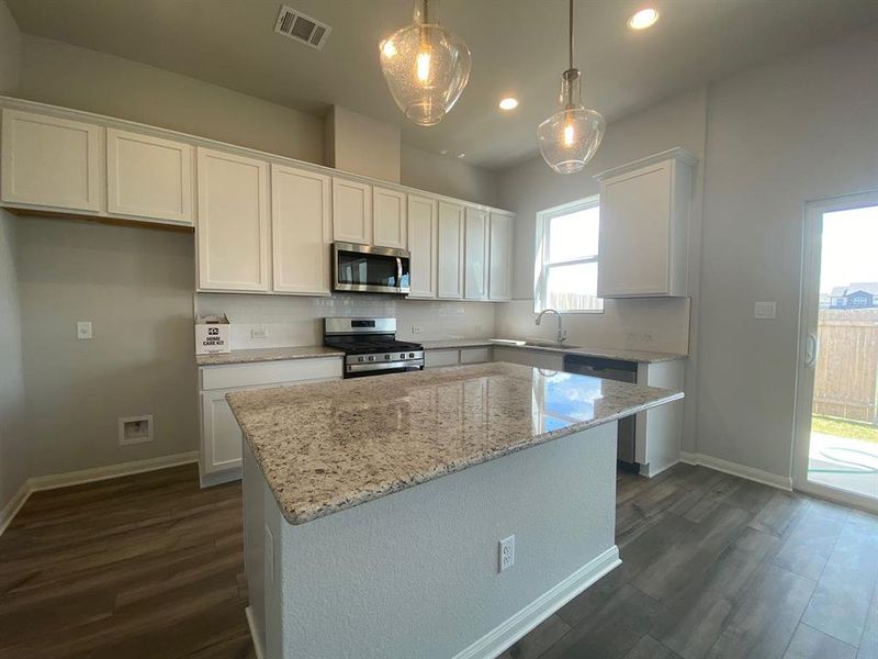 White painted cabinets, granite countertops