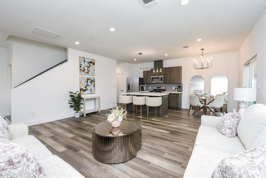 Isn't this perfection! Where there's a kitchen, it's impossible not to mingle and sample culinary treats! This is also a nice view of the breakfast/casual dining nook, up right; with easy access to the stairway, left.