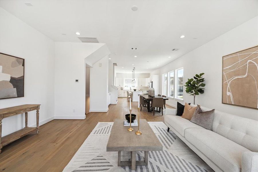 Walk in pantry in the corner of this lovely kitchen. Half bath for guests to the left.