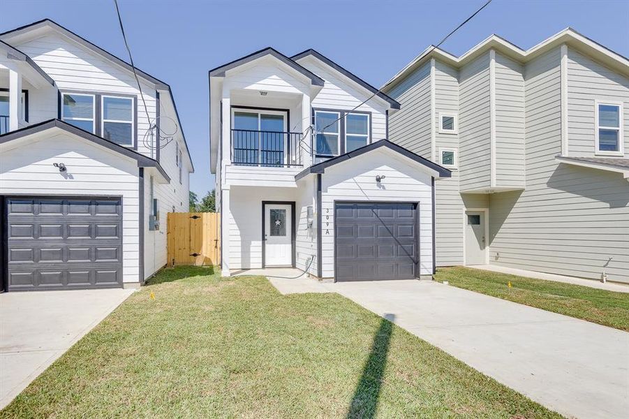 The front of the home boasts ample green space, providing the perfect canvas for beautiful landscaping. Whether you envision a lush garden, decorative plants, or a well-manicured lawn, this generous area offers endless possibilities to enhance the curb appeal and create a welcoming entrance.