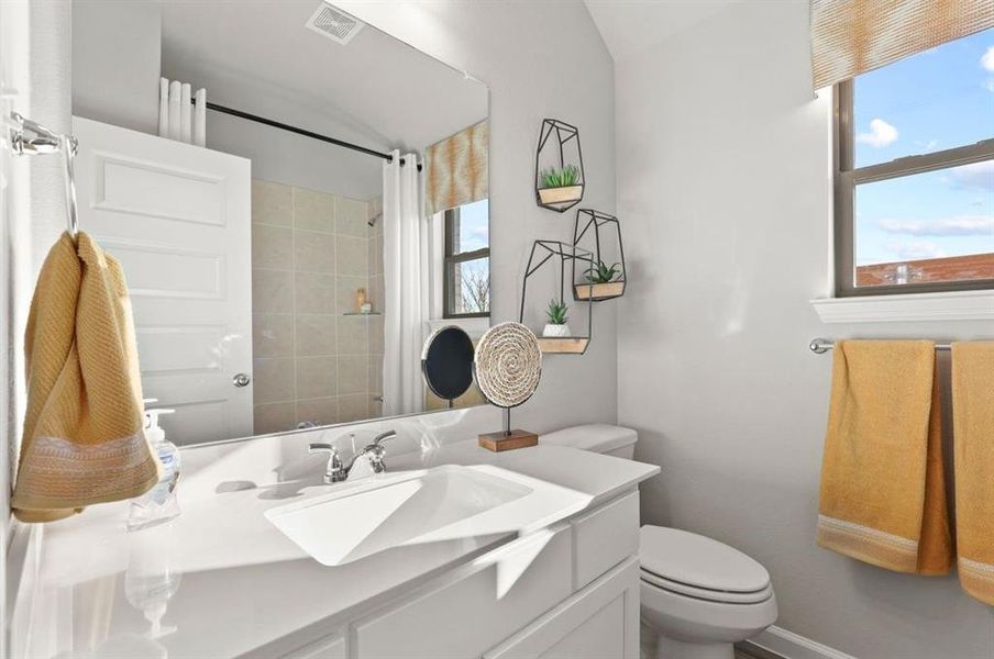 Bathroom in the Diamond home plan by Trophy Signature Homes – REPRESENTATIVE PHOTO