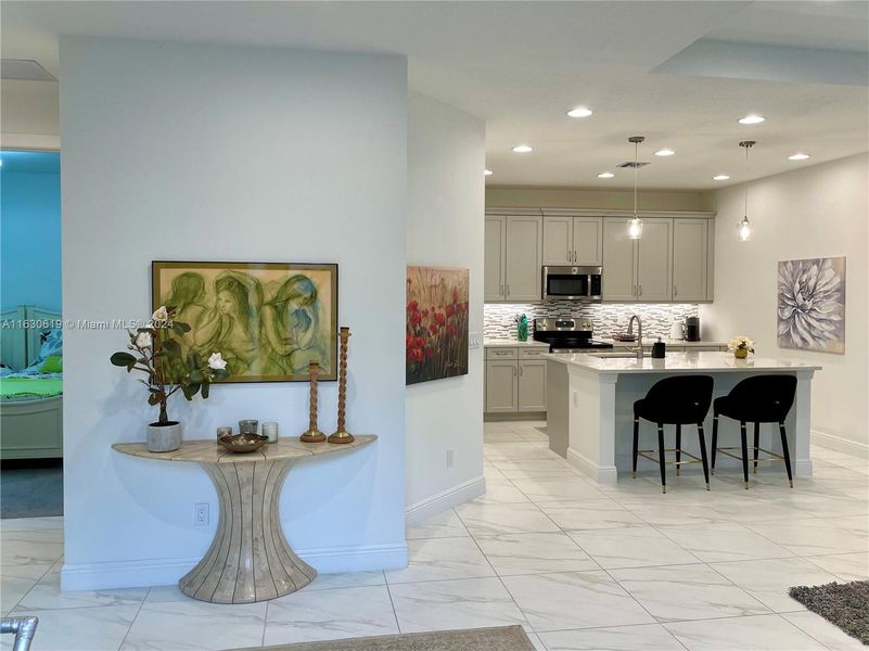 The kitchen and second bedroom as viewed from the main entry to the home