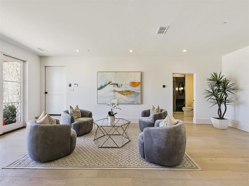 Living room with light wood-type flooring