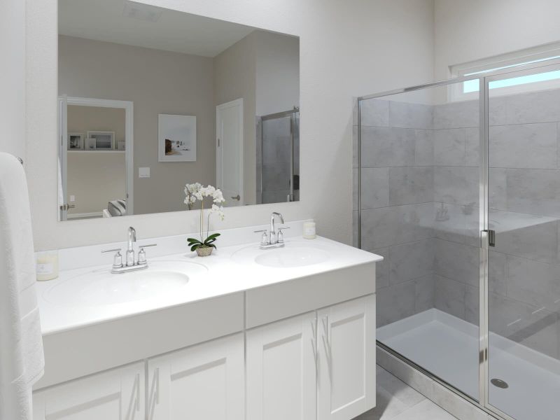 Relax and unwind in the luxurious primary bathroom.