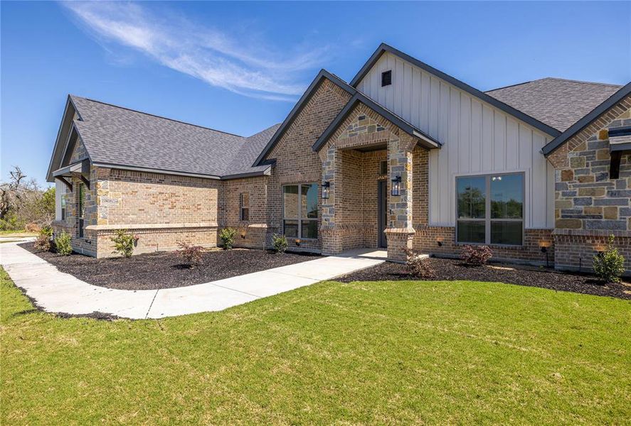 View of front of property with a front lawn