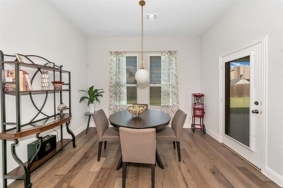 Dining space featuring wood-type flooring