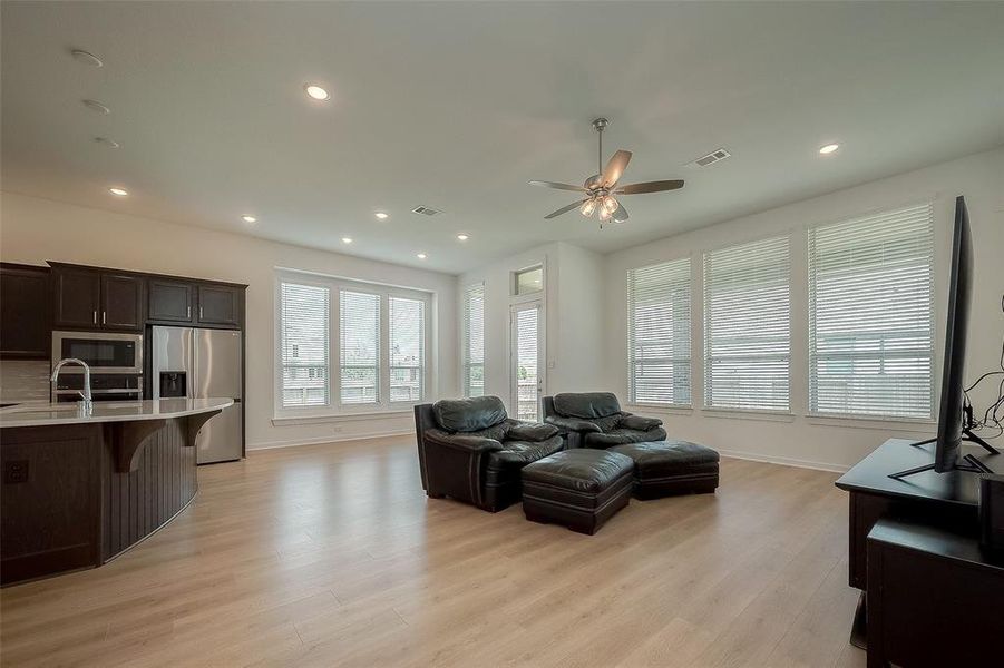 Living room has great size, open floor plan, views out the window of the corner lot. Private space.
