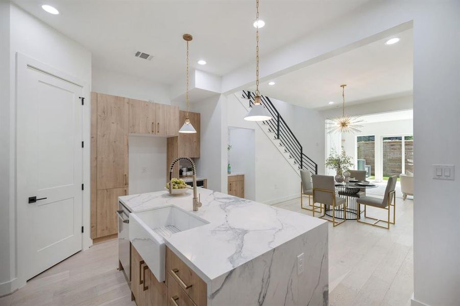 The pull down faucet and walk-in pantry make this kitchen both functional and beautiful