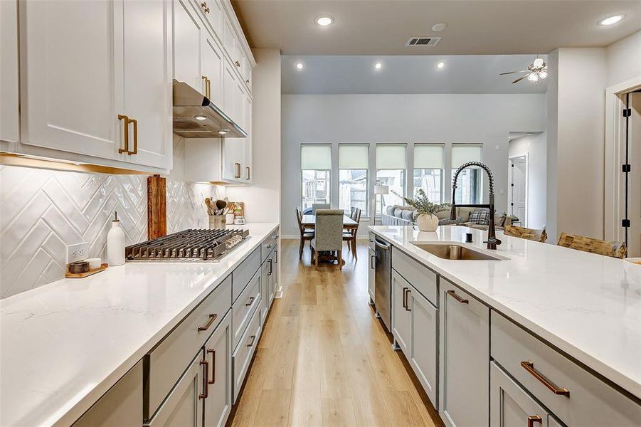 This kitchen offers and abundance of counter space to prepare meals and holiday baking is a snap with double ovens, large gas range and microwave.