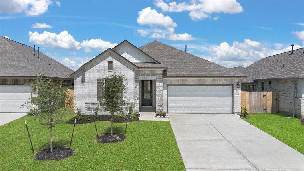 Welcome home to 31611 Madrone Berry Court located in the community of The Meadows at Imperial Oaks zoned to Conroe ISD.