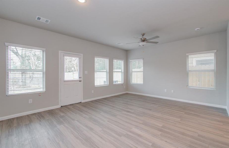 Open concept kitchen/dining living area located on first floor