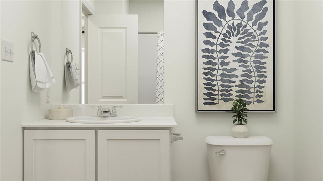 Bathroom with a shower with curtain, vanity, and toilet