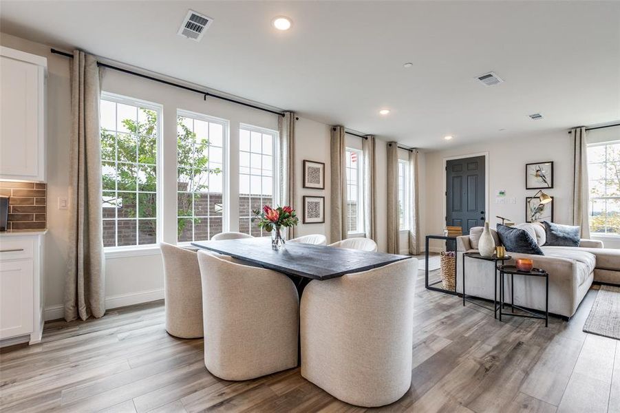 Your new dining room is flooded with natural light from a wall of windows!