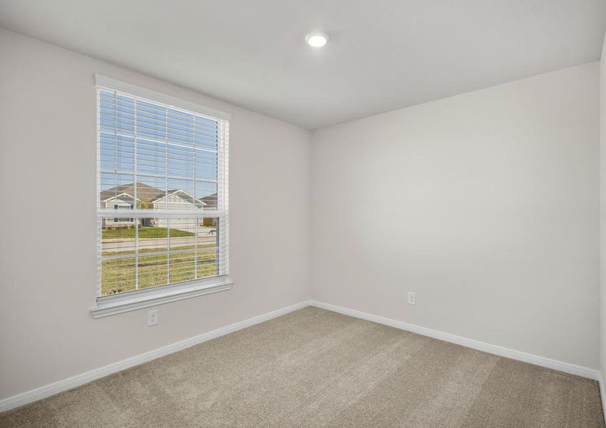 One of three additional bedrooms.