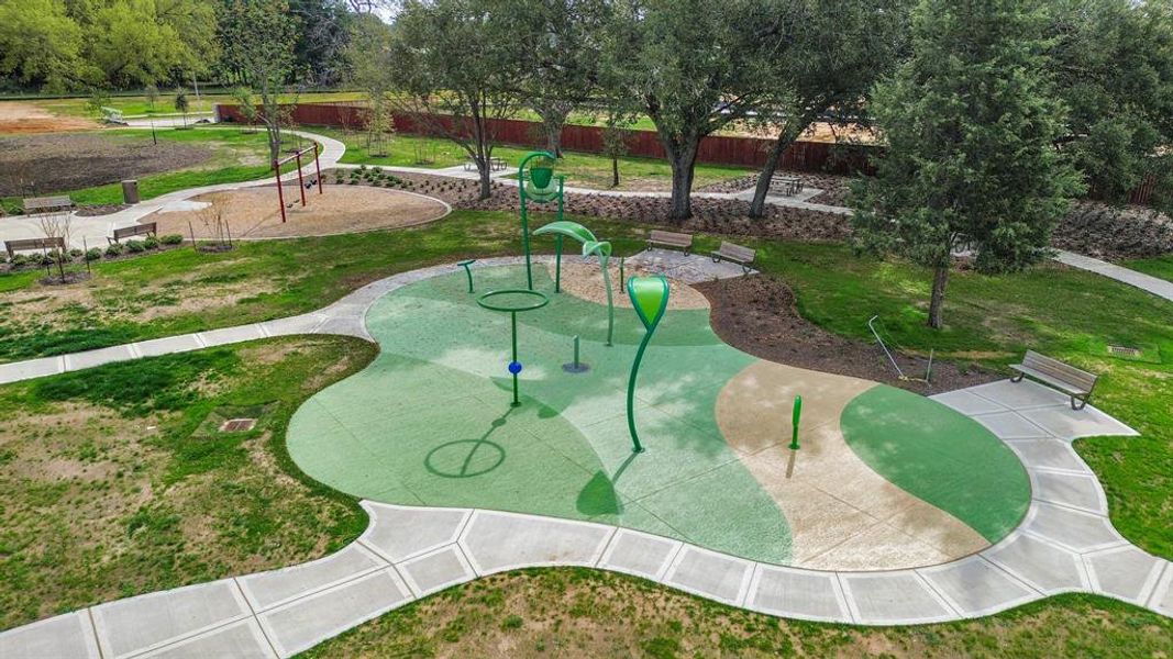 Immerse yourself in the vibrant spirit of the Oakwood community with this dedicated park area, featuring amenities for both kids and adults to enjoy. From playground adventures to serene relaxation spots, this lively space offers something for everyone, including a refreshing splash pad to beat the summer heat.