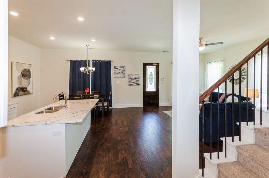 Kitchen with plenty of natural light, sink, and dark hardwood / wood-style flooring