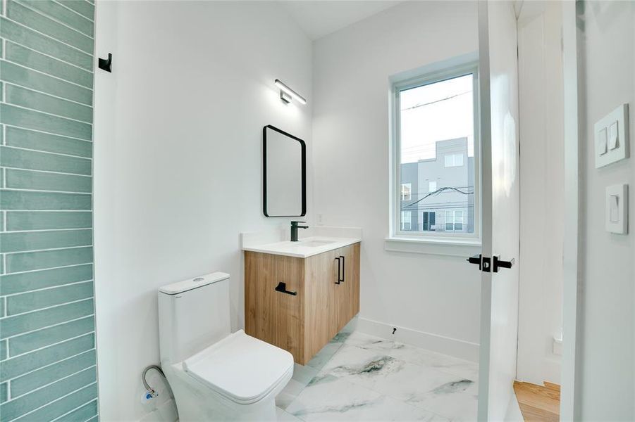 Bathroom with vanity and toilet