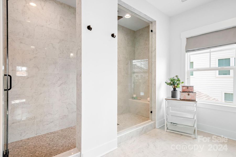 Large oversized tiled, walk in shower.  The window at the end of the room brings in natural light.