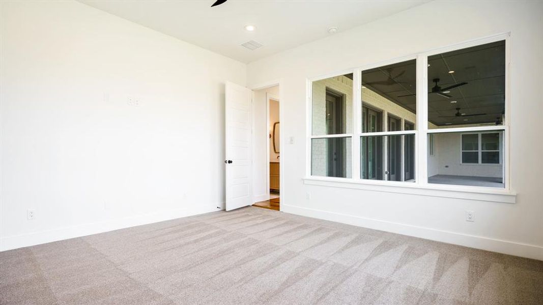 Unfurnished room with carpet and ceiling fan