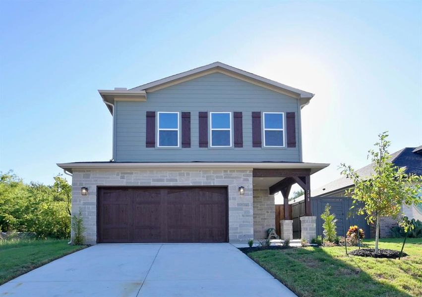 View of front facade with a front lawn and a garage