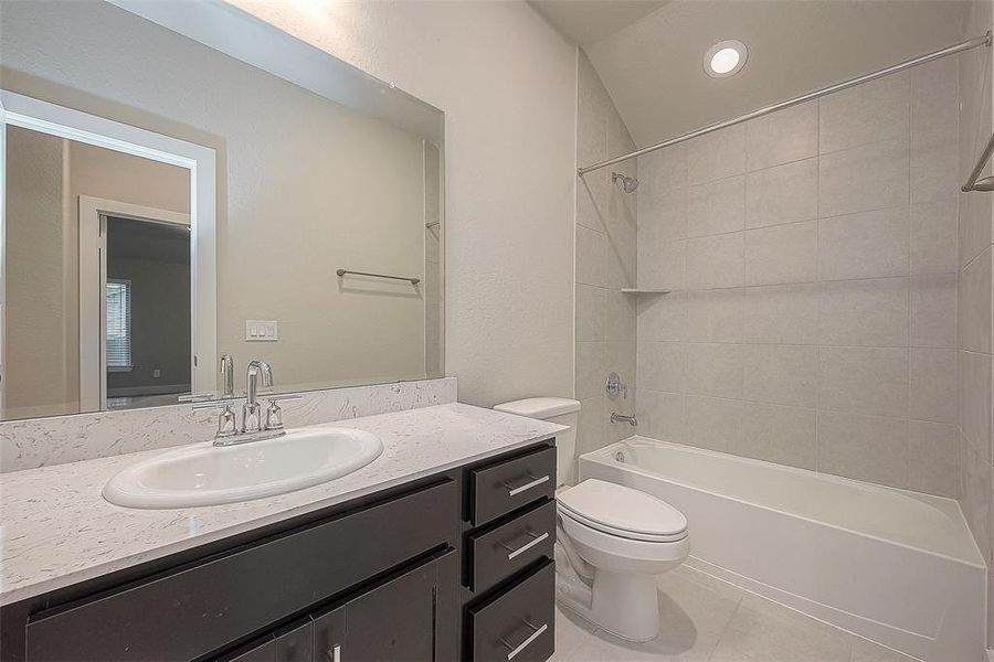 This full bath provides convenient access to the game room and bedroom 4.