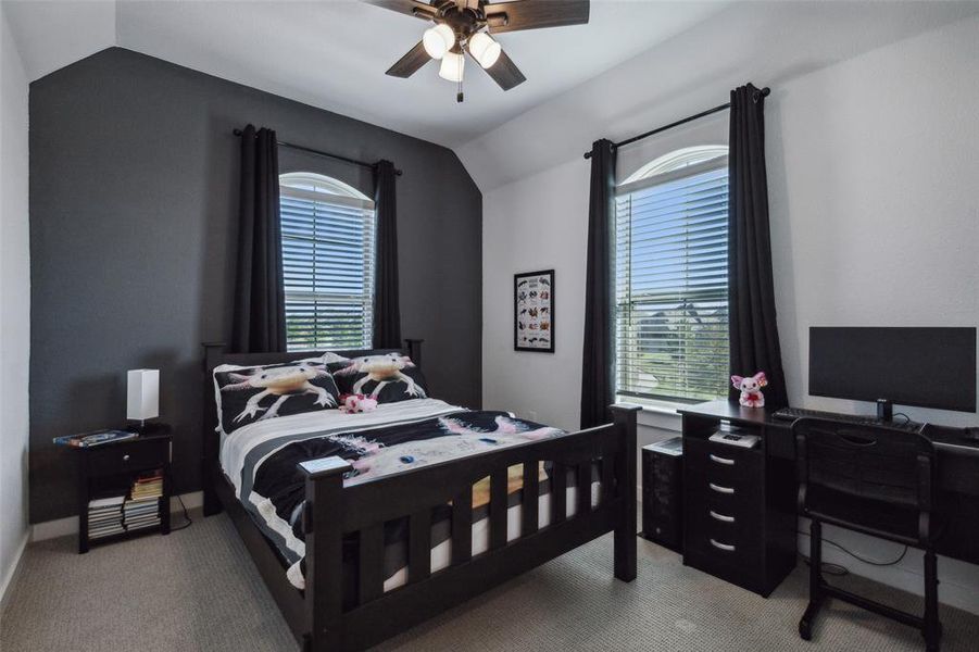 Bedroom 3 up with lofted ceiling and ceiling fan opens to Jack and Jill bath.