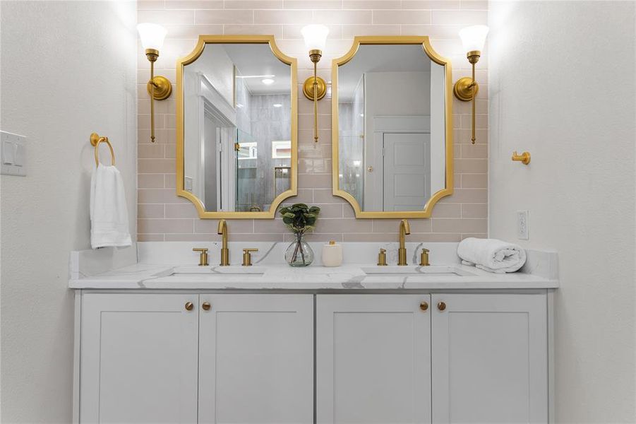 Bathroom with vanity and decorative backsplash