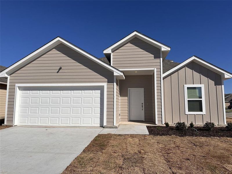 View of front of property with a garage