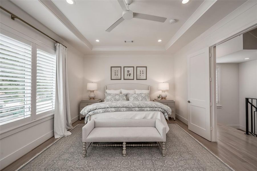 The primary suite features double doors as you enter, tray ceilings, and pleasant views of the yard.