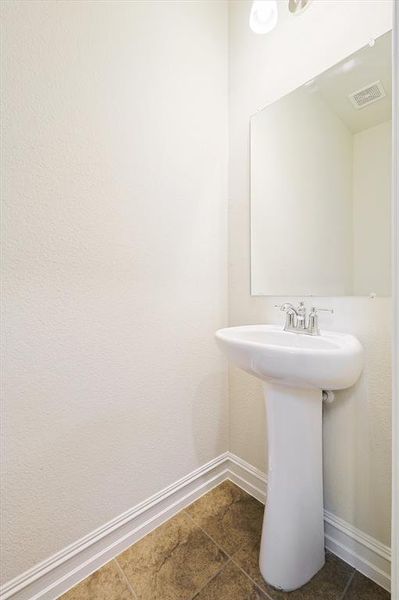 Bathroom with tile patterned flooring