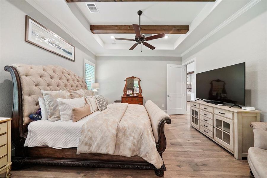 This private owner’s retreat is a great space to begin and end your day. This suite offers wood-look tile flooring, neutral paint, a raised tray ceiling with wood beams and a cooling fan, a large walk-in closet (that attaches to the laundry/utility room) and a luxurious ensuite spa-like bath.