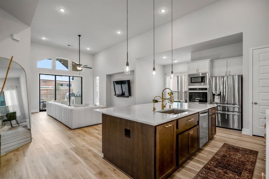 The extra-large kitchen island is perfect for conversation or that much needed space to lay out your party spread for everyone to enjoy! This kitchen conveniently connects to the breakfast area and living room for easy entertaining!