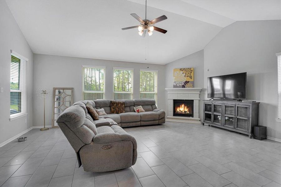 Flooded with natural light, the family room's multiple windows create a bright and inviting space.